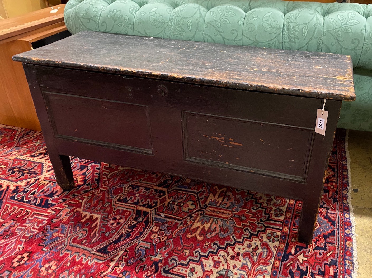 An early 19th century stained pine panelled coffer, length 113cm, depth 40cm, height 59cm